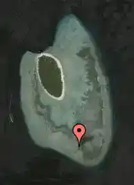 Satellite dive map marking the location of the Lobster Lairs dive site on the western wall of Sipadan Island.