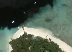 Satellite map showing the famous Sipadan Jetty and The Drop Off dive site, where divers can walk in and descend the vertical wall.