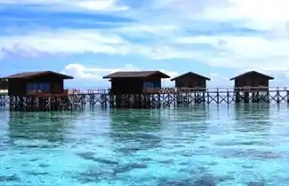 Beautiful overwater sea villas at the 5-star Pom Pom Island Resort, offering a luxury private island experience in Sabah, Malaysia.