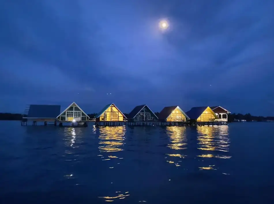 Overwater Chalets View Adil Waterhouse Resort Scenic view of the overwater wooden chalets Adil Waterhouse Resort