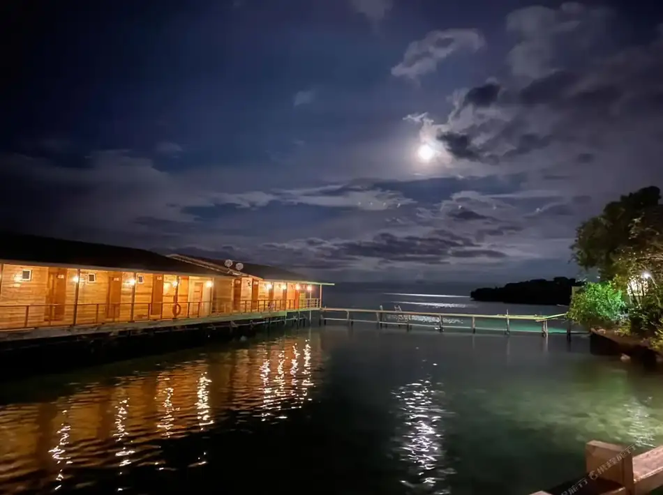 Overwater Chalets View Dreamy Wave Dwelling Resort Scenic view of overwater chalets at Dreamy Wave Dwelling Resort