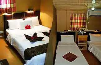 Comfortable cabins at Seaventures, showing both twin and double beds options.