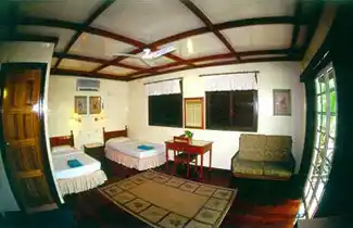 A perfect room for your family's diving holiday. Spacious chalet room at Sipadan-Mabul Resort, with a twin bed layout and sitting area perfect for a family diving holiday.