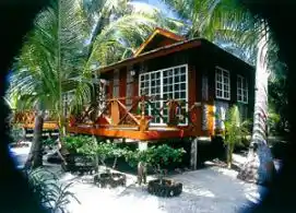Tropical Beachfront Living at Sipadan-Mabul Resort (SMART) Relax in a beautiful semi-detached chalet at Sipadan-Mabul Resort, nestled amongst lush palm trees and vibrant flowers, just steps from the white sandy beach.